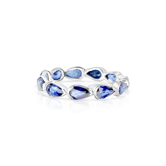 CRIS ETERNITY BAND IN 18K WHITE GOLD – PEAR SHAPED BLUE SAPPHIRE RING