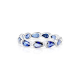 CRIS ETERNITY BAND IN 18K WHITE GOLD – PEAR SHAPED BLUE SAPPHIRE RING